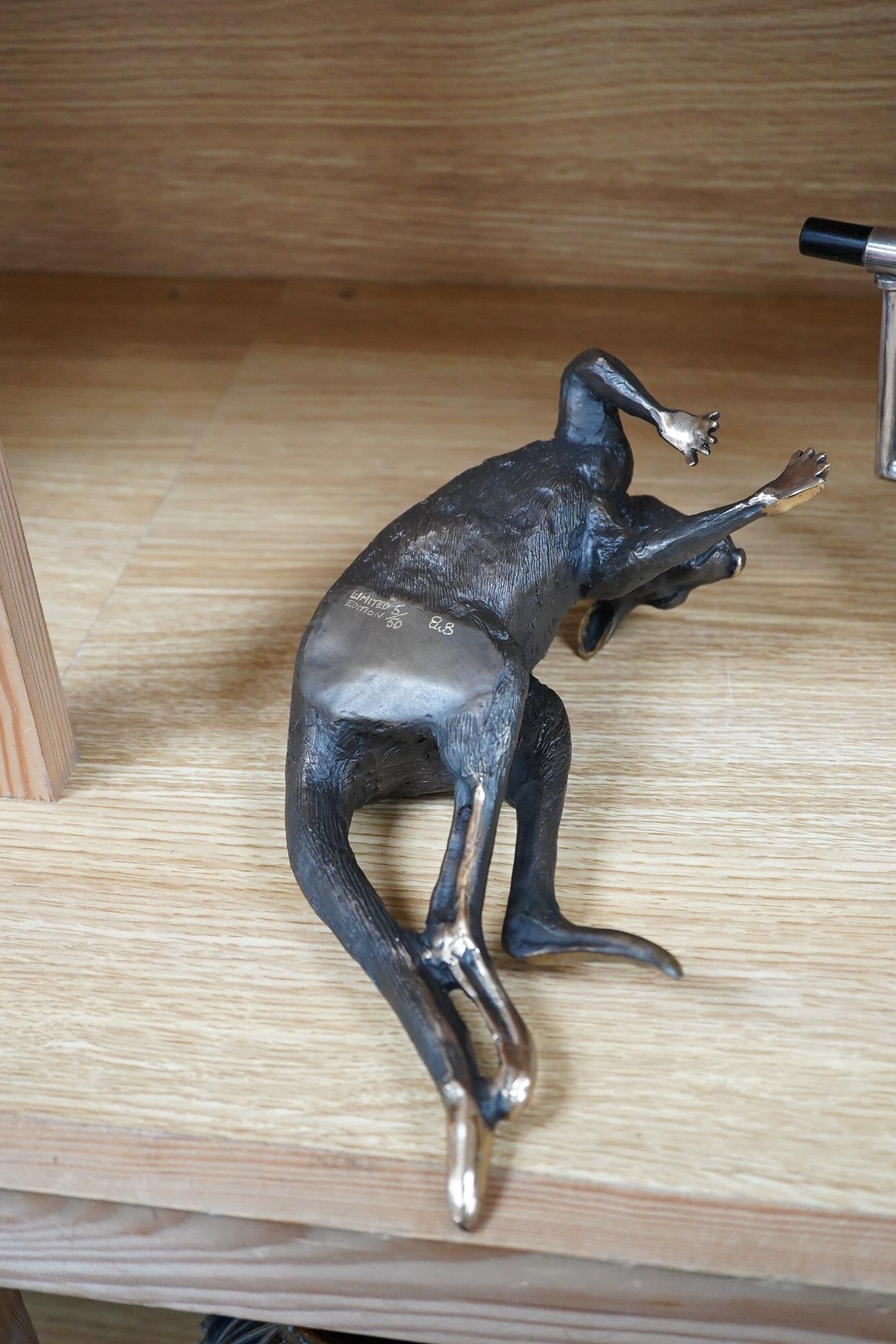 A late 20th century Australian partially gilt bronze model of a recumbent kangaroo, limited edition 5/50, 26cm wide